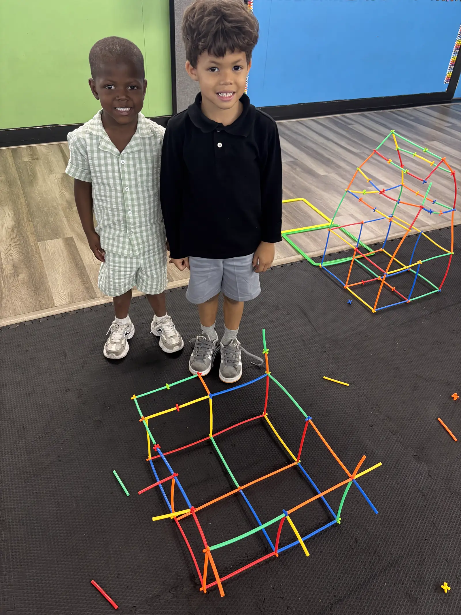 Girl building with colorful connector sticks